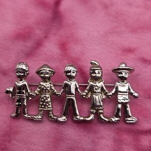 664.  Vintage Children Around The World Brooch